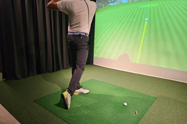 istock Golfer swings in indoor simulation with projection technology 2189756466