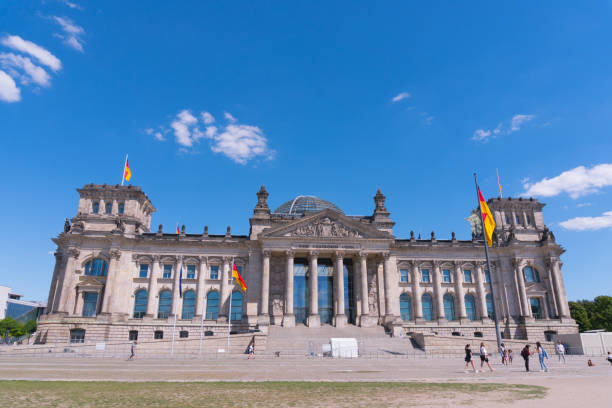 istock The Reichstag facade with German flags 2189756894