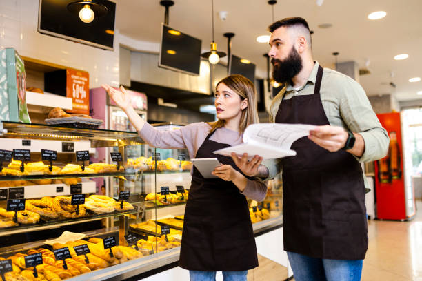 istock Mid audlt  startup partners taking online orders, pastry, and bakery food shop 2189757105