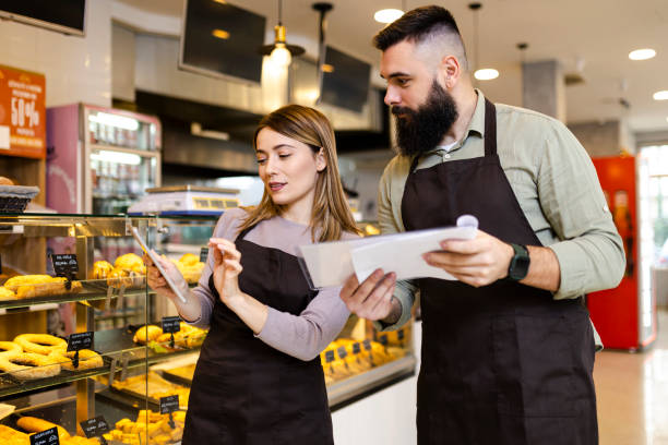 istock Mid audlt  startup partners taking online orders, pastry, and bakery food shop 2189757470