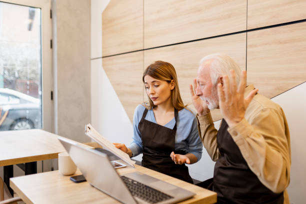 istock Two business people having an argument at coffee shop 2189758205