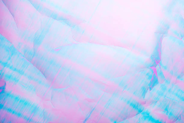 An abstract background featuring pastel hues of pink and blue with a textured crumpled paper effect.