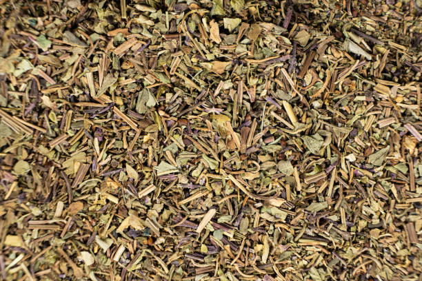 istock Dry basil spice seasoning macro texture top view 2189760828