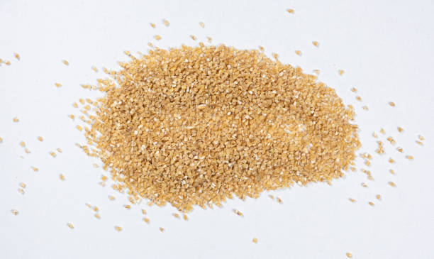 istock Scattered wheat groats on white background, top view. 2189760894
