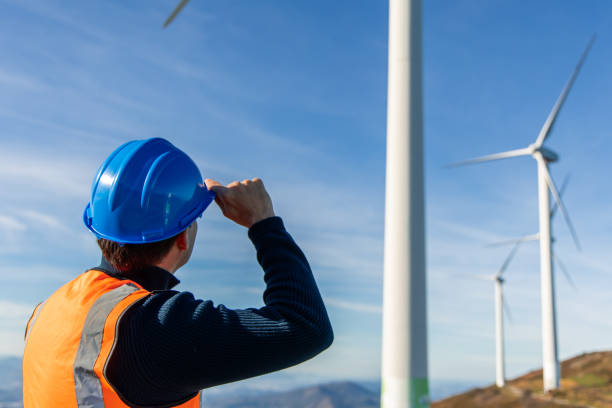 istock Engineer inspecting wind turbines for green energy production 2189762674