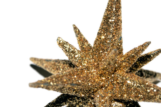 Festive Gold Glitter Star Shaped Abstract Ornament On White Background