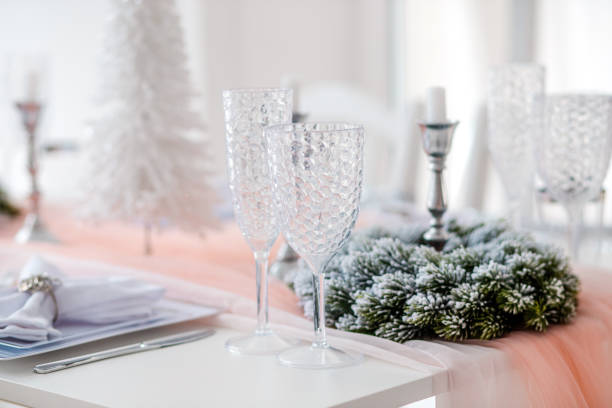 istock Elegant holiday table setting with candles and decorative accents in bright room 2189771211