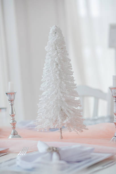 istock Elegant table setup featuring a white decorative tree, ideal for holiday gatherings 2189771257