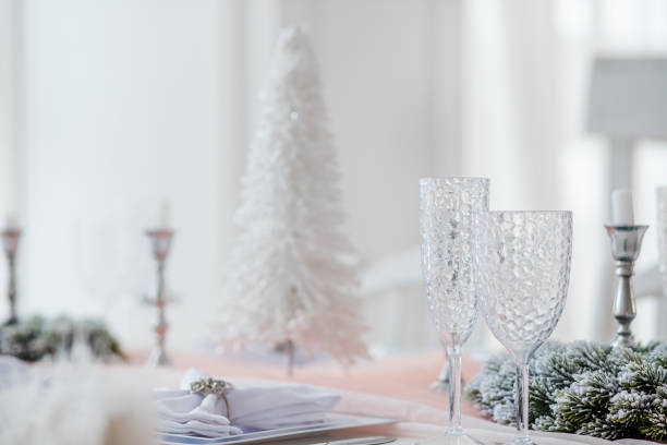 Elegant table setup featuring a white decorative tree, ideal for holiday gatherings