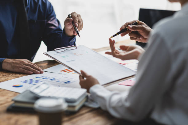 istock Businessman meeting with consultants discussing data analysis, charts and graphs in financial reports to plan investments and increase company profits. 2189771468