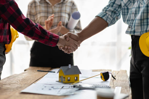 istock Collaboration of engineers, architects and contractors. Architects hand in hand promote teamwork cooperation of colleagues in construction projects. 2189771528