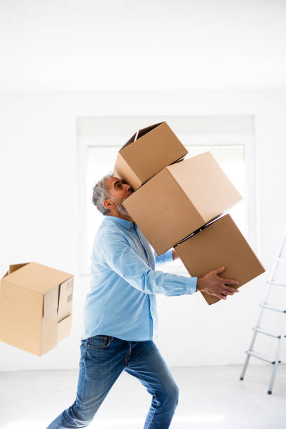 istock Mid adult man with moving box at the new apartment 2189772461