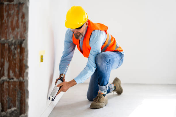 istock A man installs a floor skirting board 2189773194