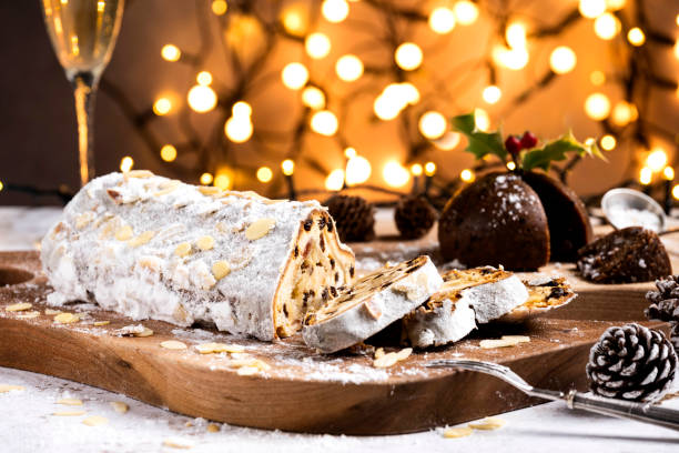 istock Sliced German Christmas fruit cake known as Stollen cake with bokeh background 2189777111