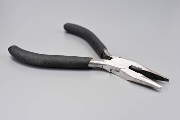 Black-handled pliers at an angle 03