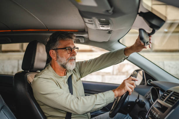 istock Senior mature man adjust look mirror during road preparation 2189782823