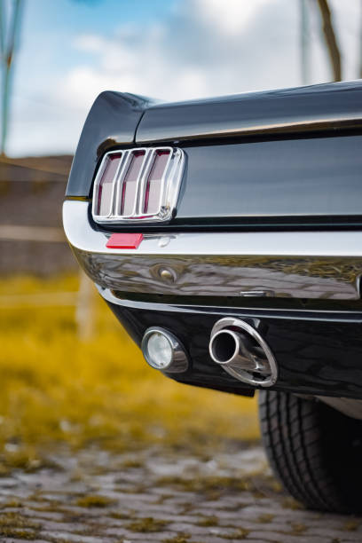 istock Close-Up of a Classic Car Rear with Tail Light and Exhaust Pipe Highlighted 2189784102