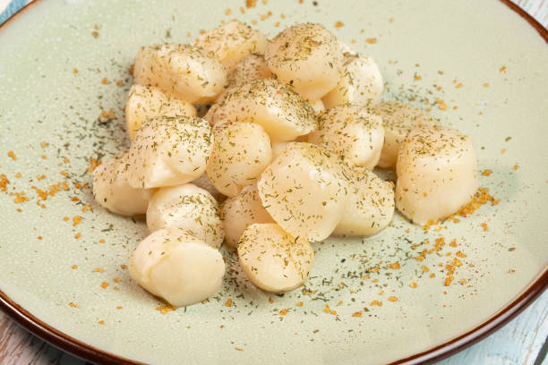 istock plate of scallops, close up 2189784182
