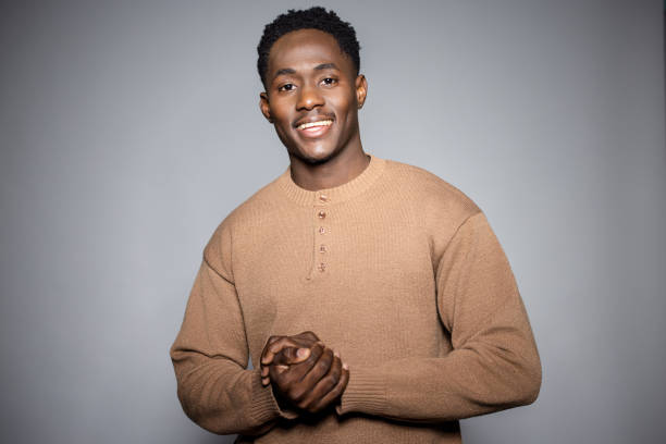 istock Charismatic Young Black Man in Neutral Studio Lighting 2189785952