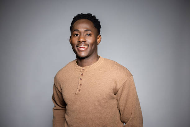 istock Young Black Man Smiling in a Professional Photo Studio 2189786014