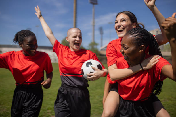 istock Female soccer players celebrating victory 2189786748