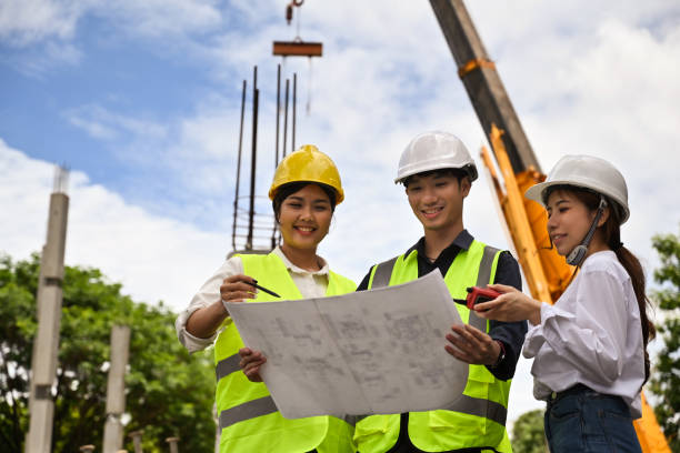 istock Civil engineers, architects and contractors Checking the blueprint for building construction, Outdoors 2189788393