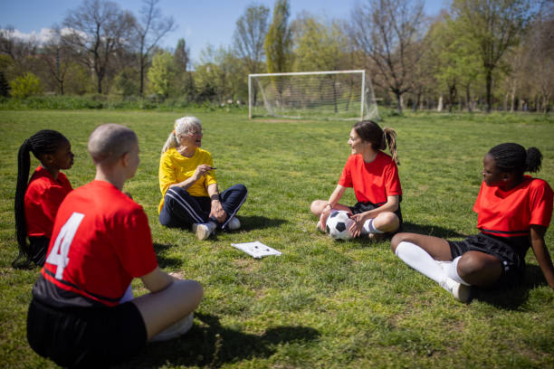 istock Soccer coach talking to her players 2189788774