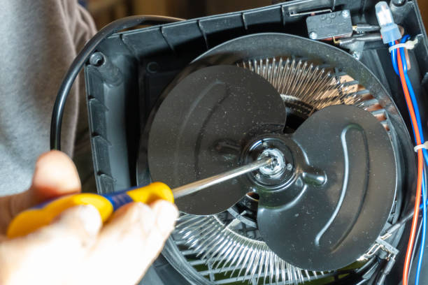 istock handyman electrician fixing a small appliance at home 2189788964