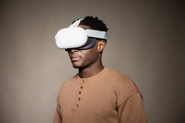istock Young Black Man Wearing Virtual Reality Headset in a studio portrait 2189790336