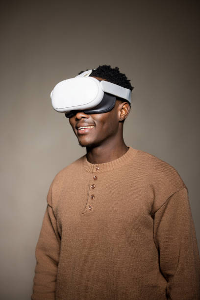 istock Studio Portrait Smiling Black Man in Virtual Reality Headset Gear 2189790346