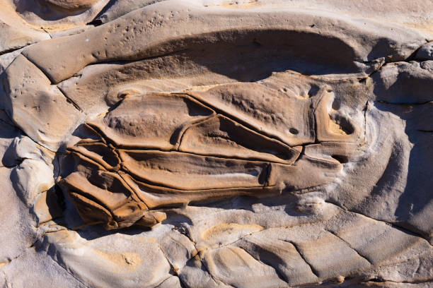 Rocky golden-yellow rock formations. The result of running hot lava flowing from volcanoes that were active on the island of Lemnos.