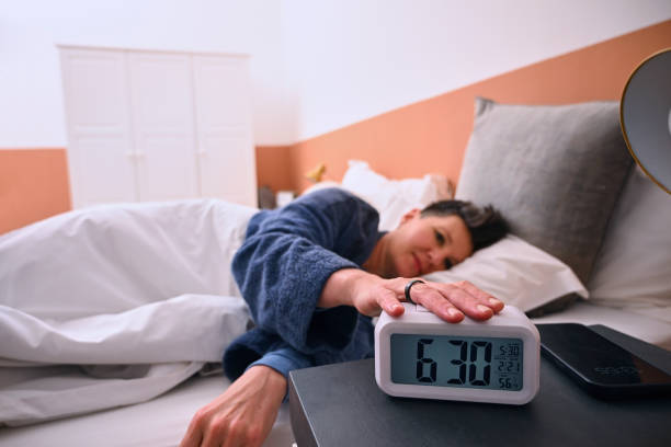 istock Woman waking up in bed 2189791695