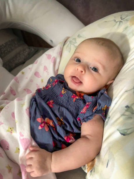 Two month baby awake and smiling