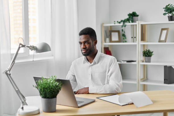 istock computer man education laptop job cyberspace office american african student online freelancer 2189794752