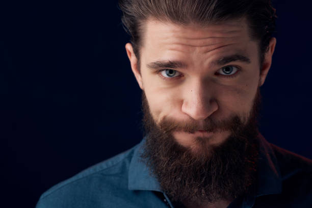 istock bearded man in a black shirt smoke clouds dark background 2189795021