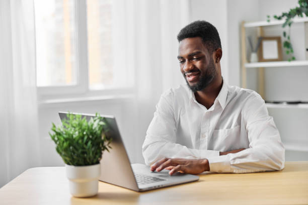 istock man freelancer job american education computer online laptop office student modern african 2189795710