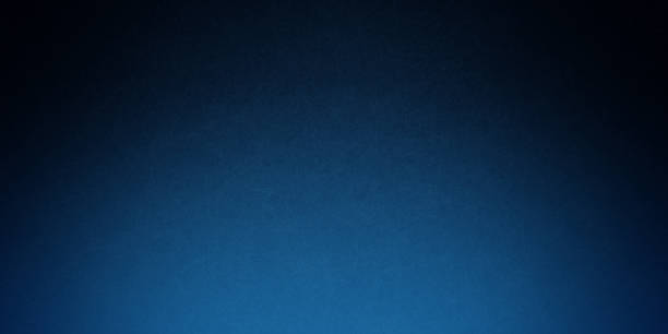 istock Blue grainy gradient noisy background, light to dark azure sapphire cerulean denim blue smooth noise texture banner backdrop design 2189796442