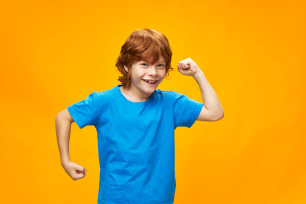 istock The red-haired child is gesturing with her hands for fun 2189796774