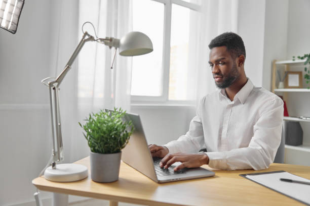 istock man office laptop job copy freelancer online computer space education american african student 2189796963