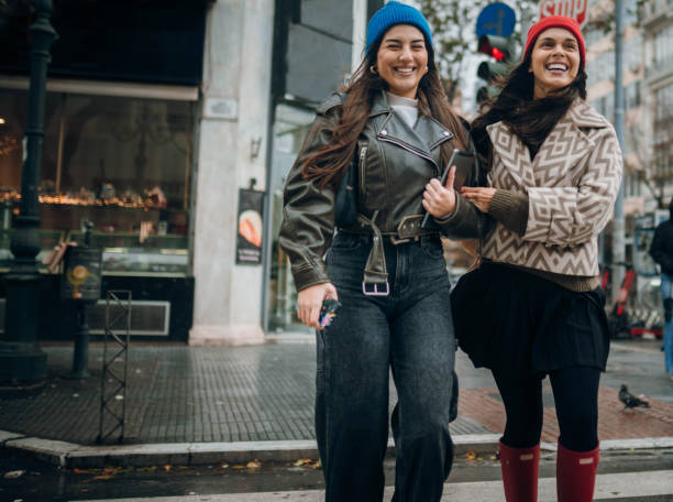 istock Two young women talking on a crosswalk 2189797164