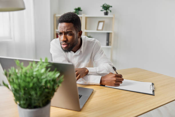 istock freelancer man laptop job online conference american education student african computer office 2189797444