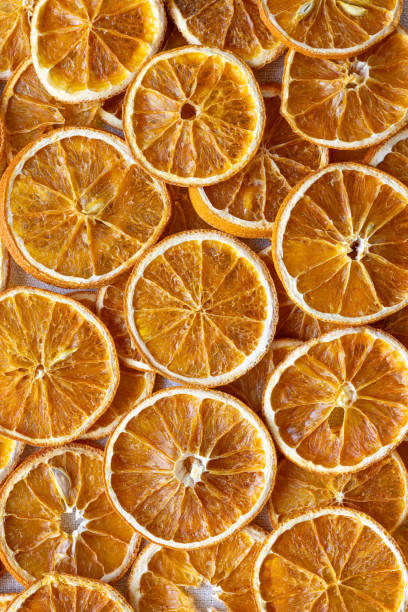 istock Dried tangerine slices close-up background 2189798201