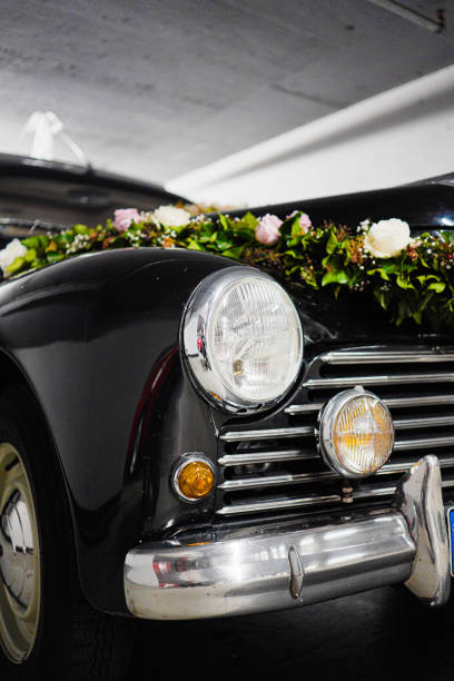 Red bow tied on a white car door handle. Traditional Chinese wedding concept.