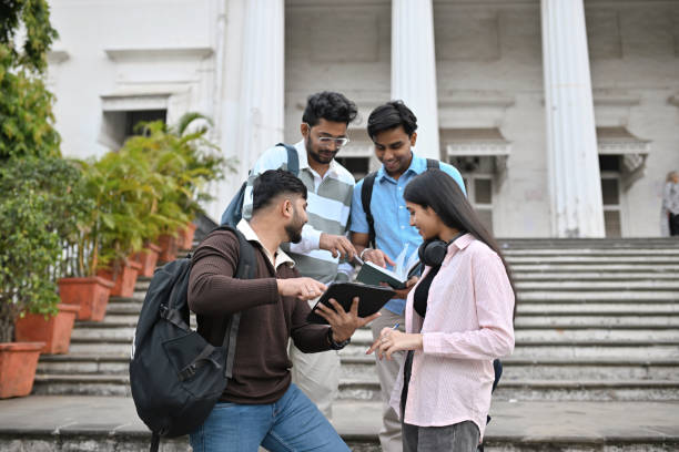 istock University students studying and discussing standing on the steps of the campus 2189800021