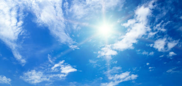 istock Blue sky with white clouds and sun. Wide photo. 2189800034