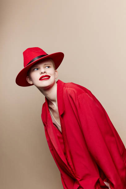 istock glamorous woman in a red hat and jacket makeup studio model unaltered 2189801291