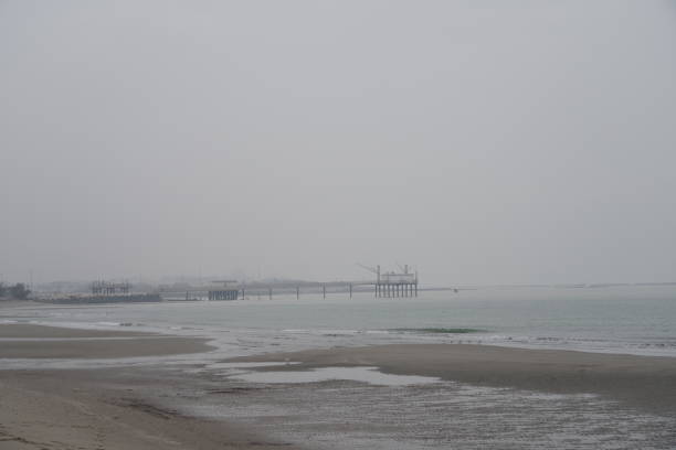 aerial view of a jetty at the entrance of the harbour of Scheveningen; The Hague, Netherlands