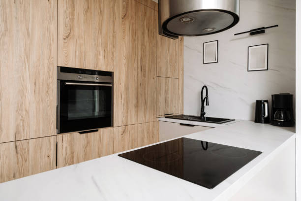 istock Modern kitchen design featuring induction stove and sleek cabinetry 2189805051