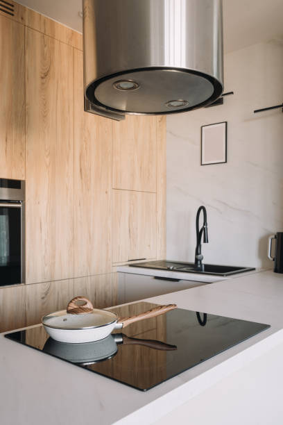 istock Modern kitchen design featuring an induction stove and sleek cabinetry 2189805055