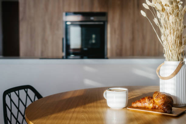 istock Enjoying a cozy breakfast with coffee and fresh croissant at home 2189805415